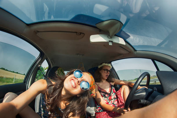 istock Women having fun in a road trip 886227012