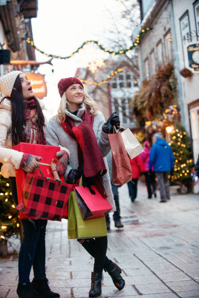 istock Christmas Shopping with two young women 886232836