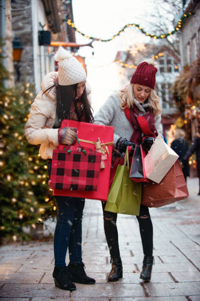 istock Christmas Shopping with two young women 886232936