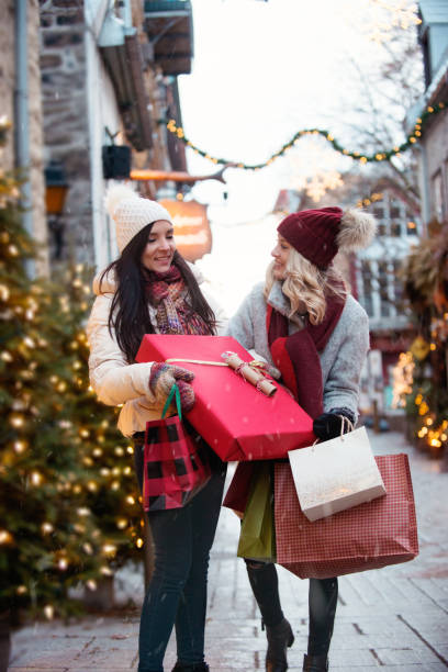 istock Christmas Shopping with two young women 886232948