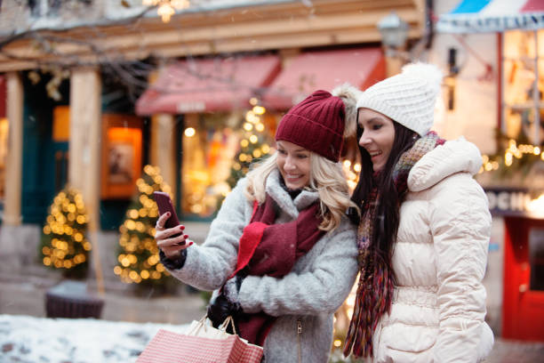 istock Christmas Shopping with two young women 886233066