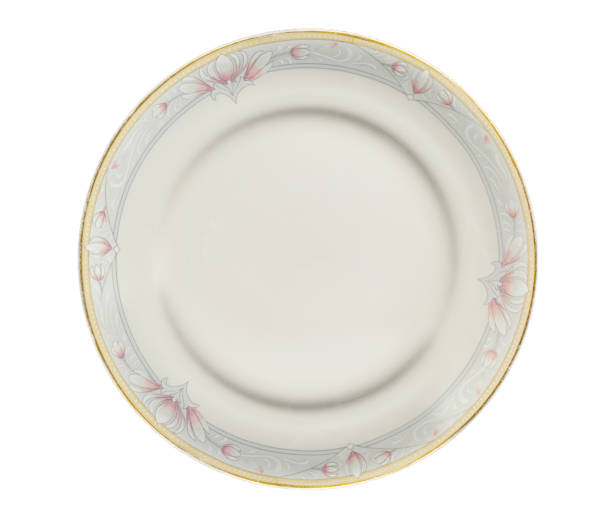 istock Porcelain or ceramic white plate, ordinary, with unique rose flower patterns, isolated on a pure white background 886240932
