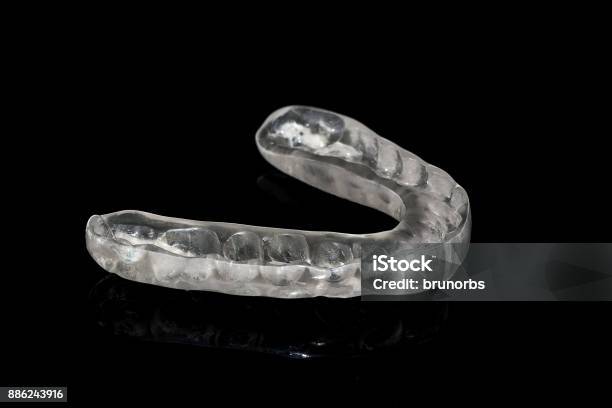 Acrylic Transparent Dental Mouth Guard On Black Background Showing Reflection Stock Photo - Download Image Now