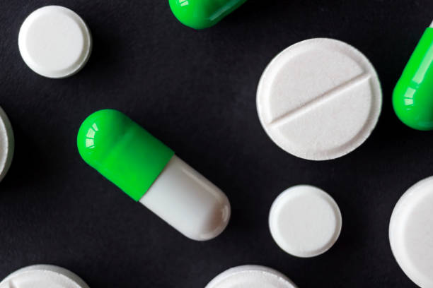 istock tablets of different shapes and sizes on a black background, macro 886258136