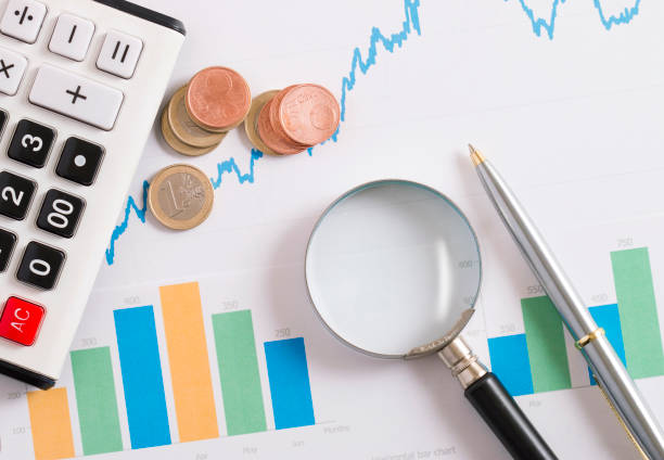 istock calculator on the rising graphic with coin 886271464