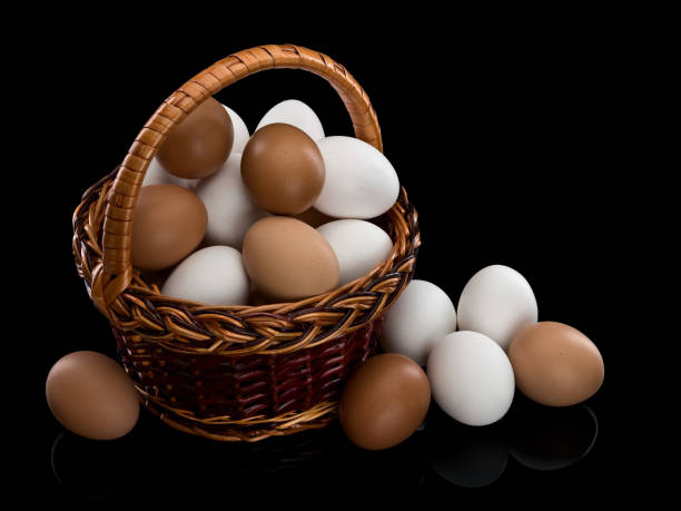 istock Basket full of white and brown eggs 886271562