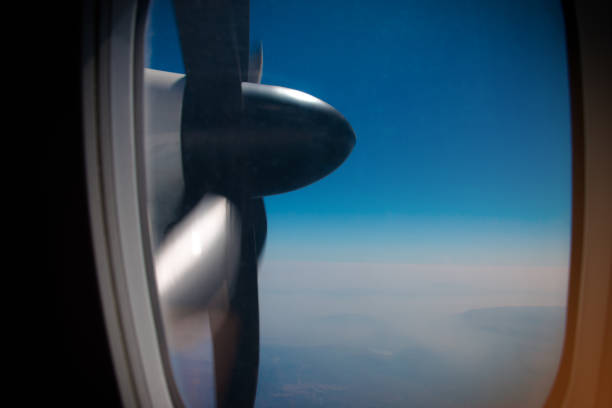 istock view of turboprop plane propeller seen through the window during flight 886280606