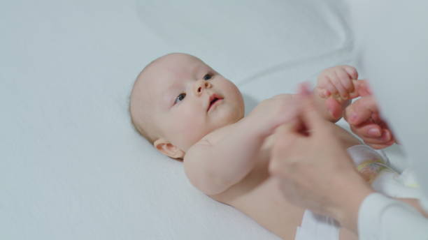 istock Parent Holding Newborns Hand 886287728