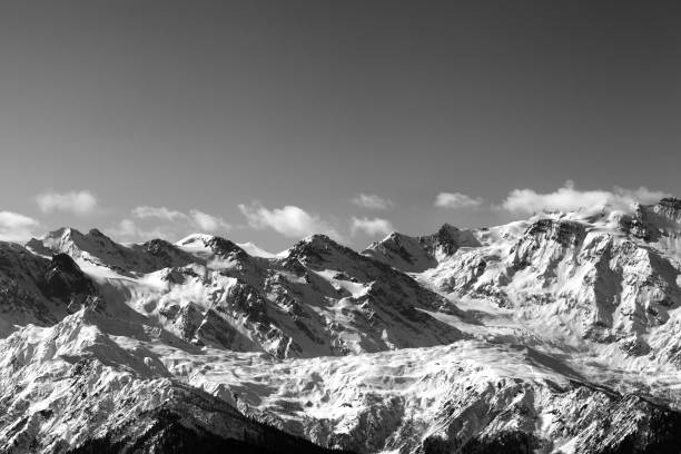 istock Black and white snow winter mountains in nice sunny day 886294676