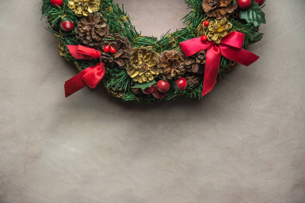 istock christmas wreath on Gray  background . 886305970