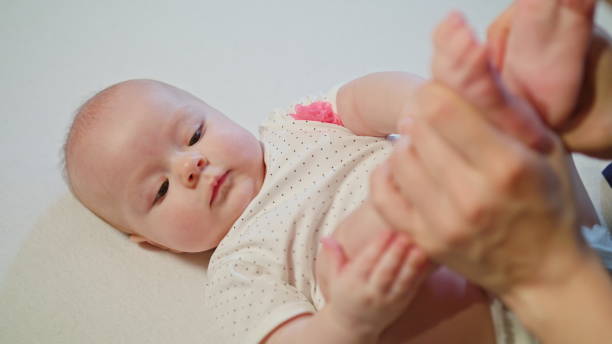 istock Mother Kissing Baby's Feet 886308910