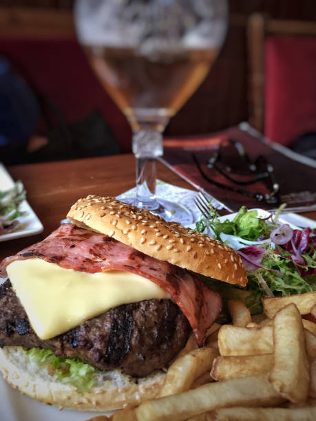 istock burger and potato fries on table 886313622