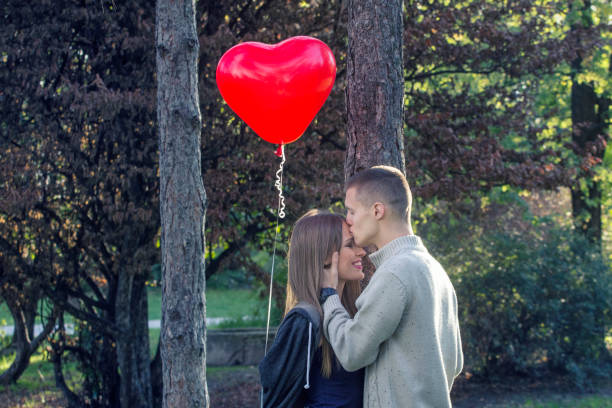 istock Young couple with balloon 886313738