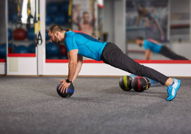 istock Fitness coach working with medicine ball 886316924