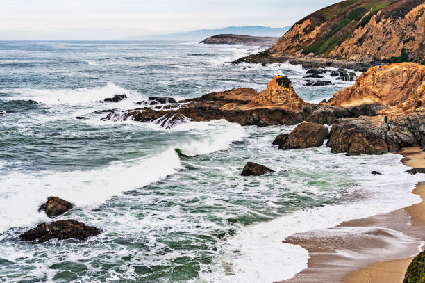 istock Bodega Bay Beach and Rocky Shoreline with People 886317004