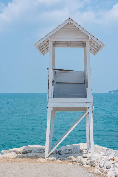 istock white hut and the sea 886335116