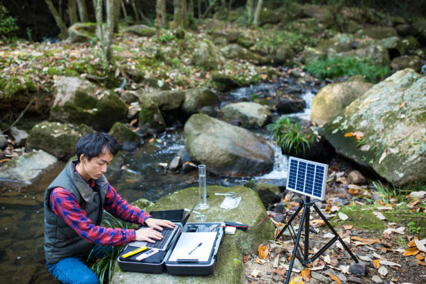 istock A scientist monitoring water quality from a solar powered field laboratory 886335570