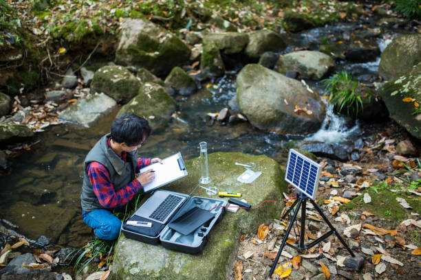 istock A scientist monitoring water quality from a solar powered field laboratory 886335572