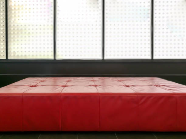 istock Red leather bench over glass wall in modern Living room 886354674
