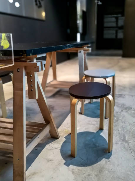 istock Modern work table with wooden chair at chic design workspace 886354714