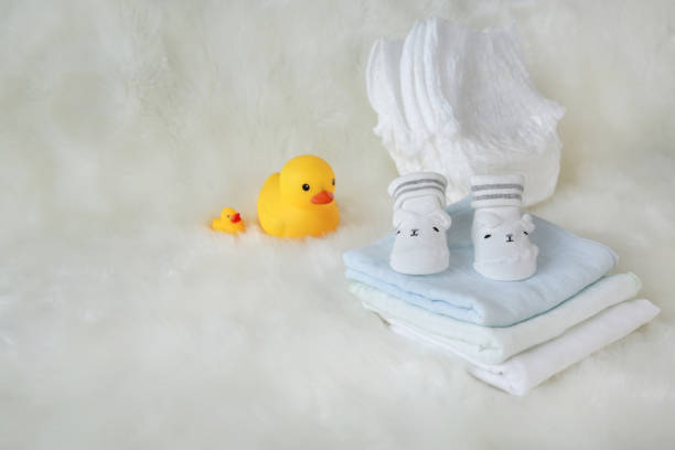 istock Collection of items for newborn babies on white fur. 886357200