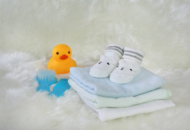 istock Collection of items for newborn babies on white fur. 886357556