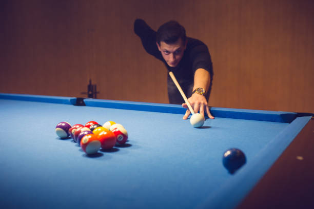 istock Semi-professional pool game player ready for the shot 886369998