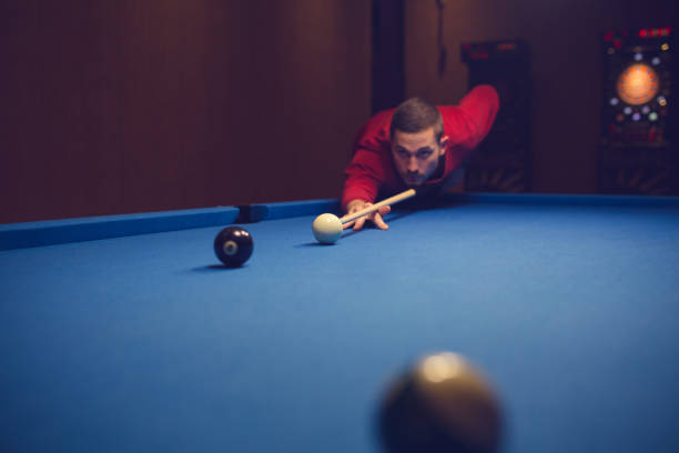 istock Hit the ball to the hole 886370016