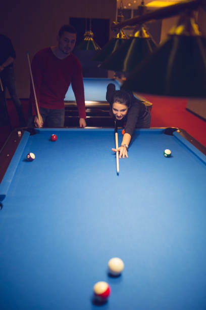 istock Young couple playing snooker 886370062