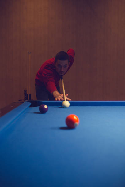 istock Semi-professional pool game player ready for the shot 886370090