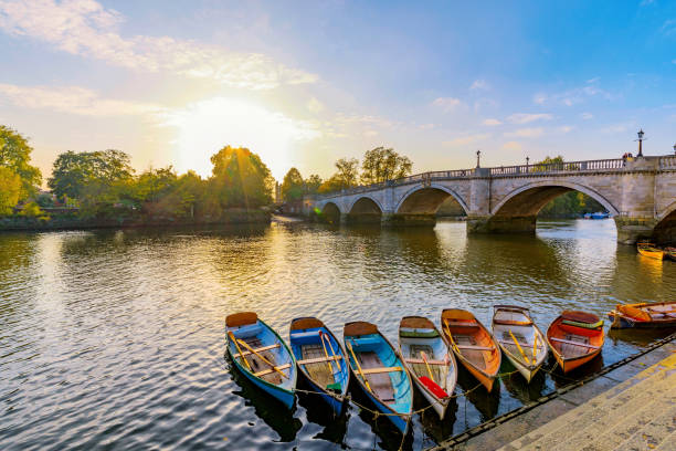 Richmond River Thames boats and bridge Richmond Thames riverfront with boats in London historic district photos stock pictures, royalty-free photos & images