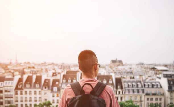 istock Man Watching over The Skyline of Paris 886374526