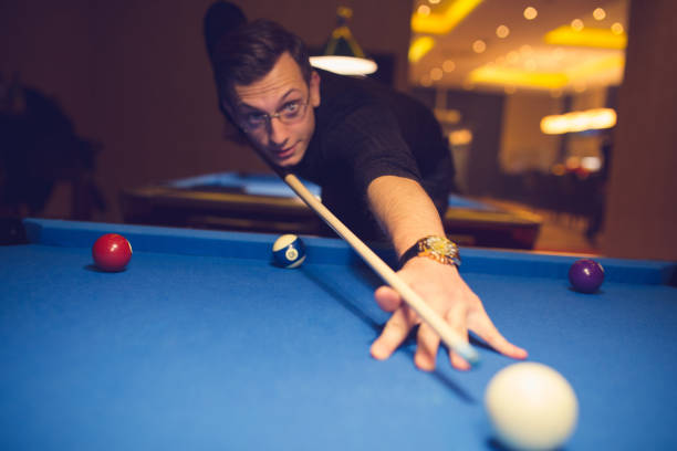 istock Semi-professional pool game player ready for the shot 886379098
