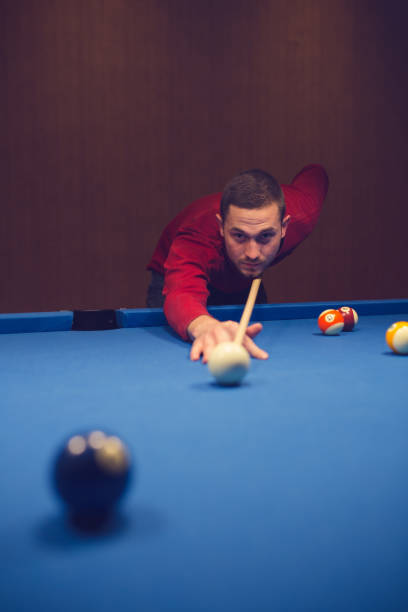 istock Semi-professional pool game player ready for the shot 886379206