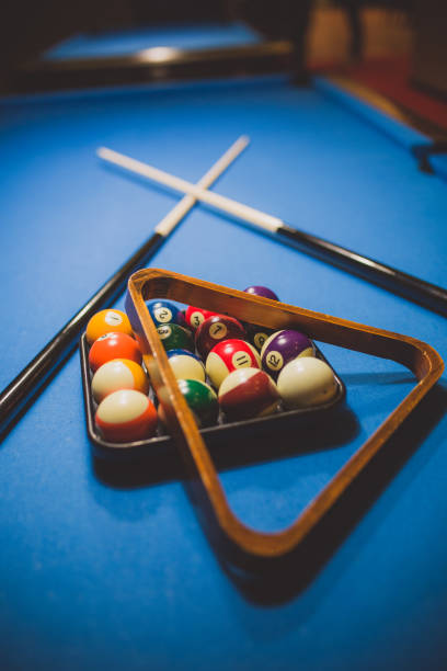 istock Billiard balls with billiard cue 886381928