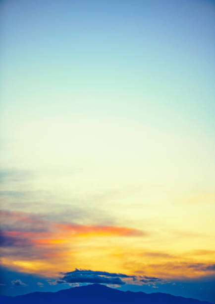 Winter sunset with mountain silhouette and clouds. Cloud Typologies