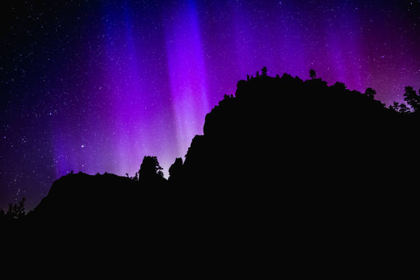 Purple Aurora Borealis or Northern Lights stock photo