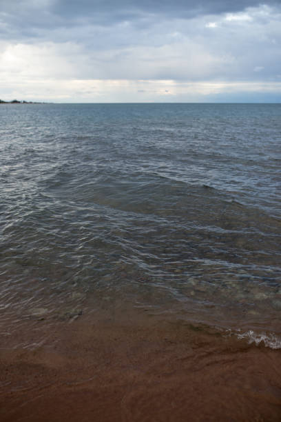 istock cloudy weather on the sea as background 886423840