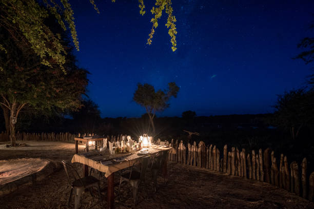 Dinner under the night sky at a luxury safari lodge in Botswana Africa