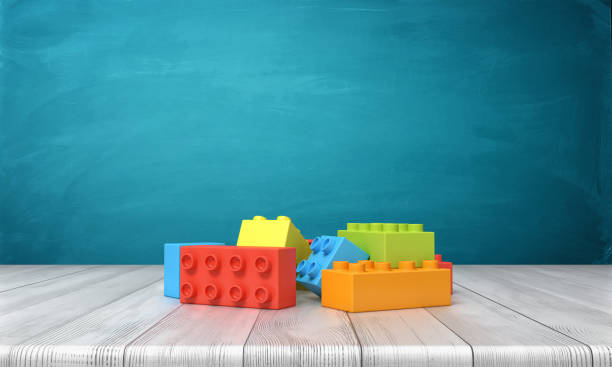 renderização 3d, um brinquedo de blocos de construção deitado em uma pilha colorida sobre uma mesa de madeira sobre um fundo azul - material variation timber stacking - fotografias e filmes do acervo