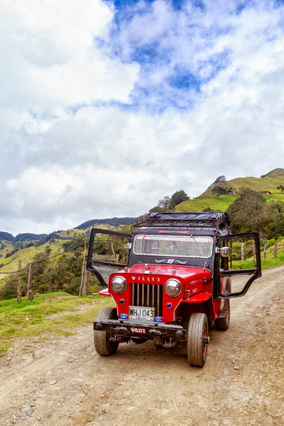 Jeep Trip Portrait view of a red jeep used for tours with the doors open in the mountains outside of Salento, Colombia on June 7, 2016. tolima stock pictures, royalty-free photos & images