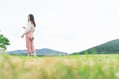 woman listening to music in nature.