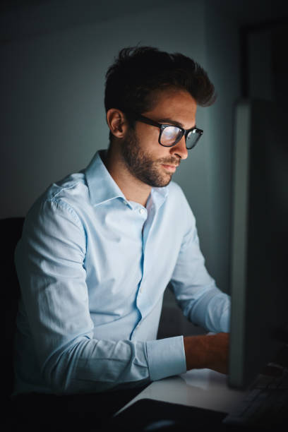 istock Powering through the night to get ahead 886465838