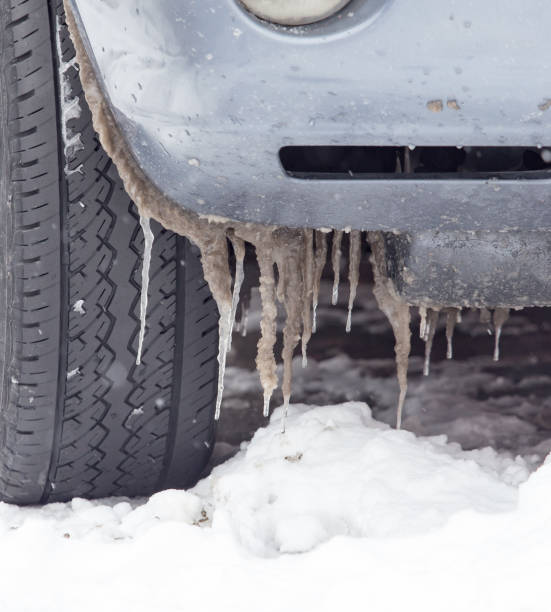 istock snow and icicles on cars in winter 886472698