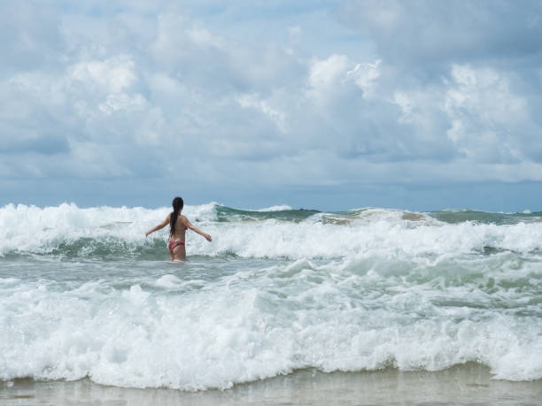 istock beautiful girl on the beach 886479066