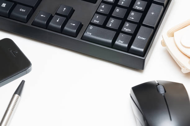 istock Computer keyboard and mouse, pen, wooden car, phone isolated on white background 886479246