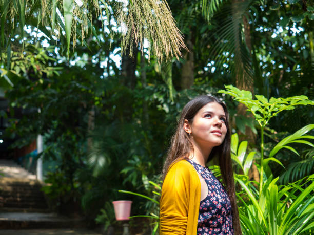 Girl walking in tropical forest of Sri-Lanka