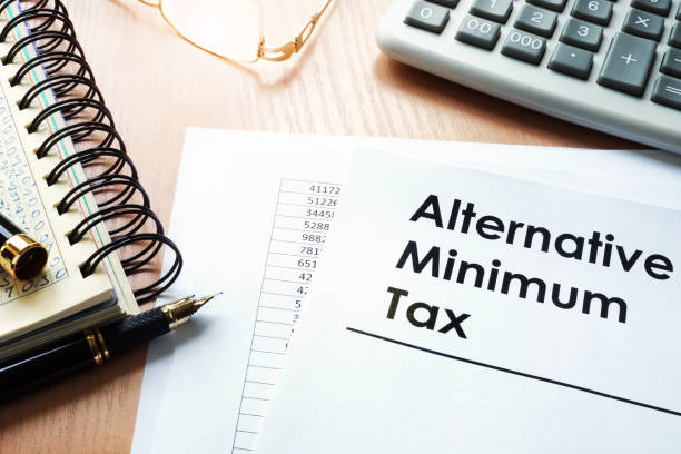 istock Alternative Minimum Tax (AMT) and  calculator on a desk. 886482972