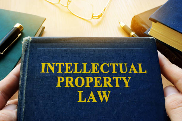 istock Intellectual property law and other books on a desk. 886485202