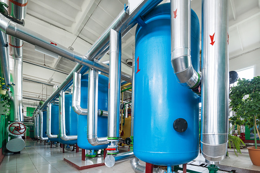 Water treatment system for boiler station. Many pipelines, pumps and valves.